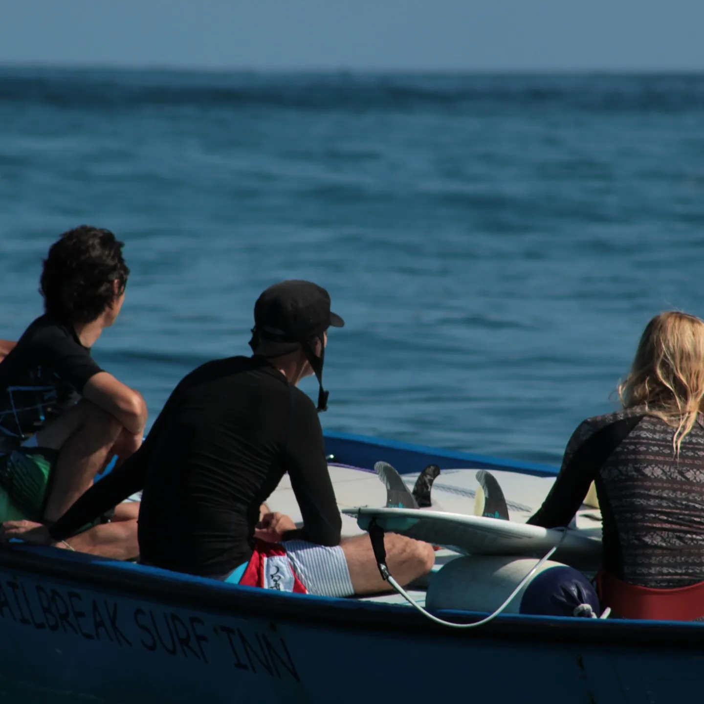Surfers on a boat